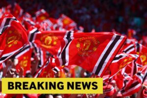 Manchester-United-fans-with-flags.jpg